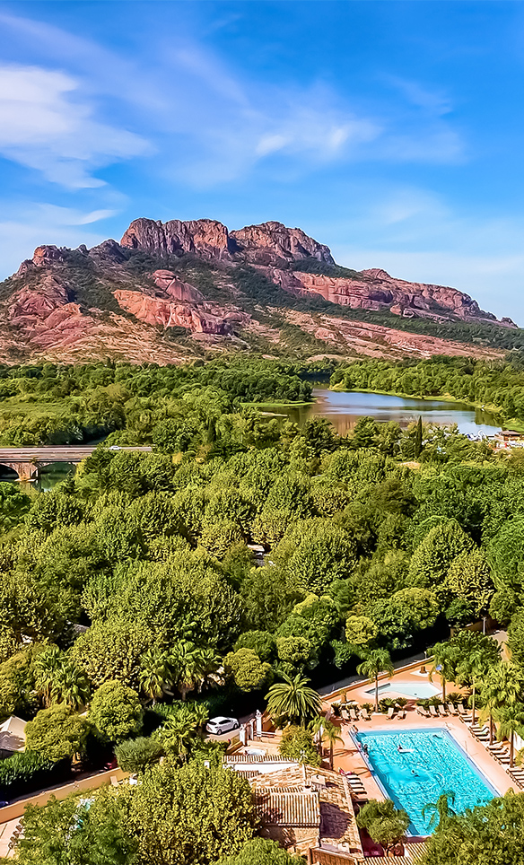 wooded park at the foot of the majestic rock